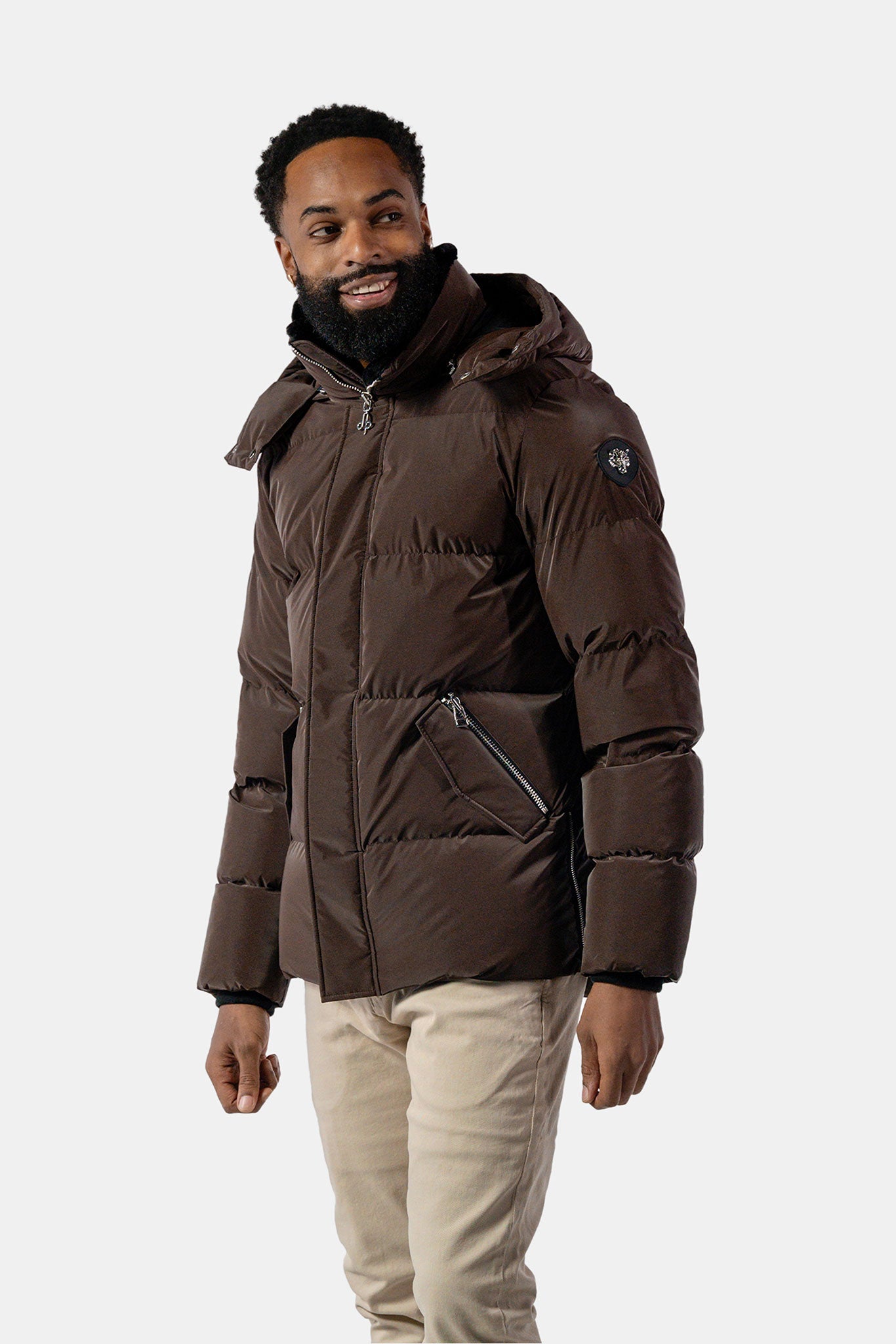 Woodpecker Men's Bumnester Bomber Winter coat. High-end Canadian designer winter coat for men in "Mocha Diamond" colour. Woodpecker cruelty-free winter coat designed in Canada. Men's heavy weight medium length premium designer jacket for winter. Superior quality warm winter coat for men. Moose Knuckles, Canada Goose, Mackage, Montcler, Will Poho, Willbird, Nic Bayley. Shiny parka. Stylish winter jacket. Designer winter coat.