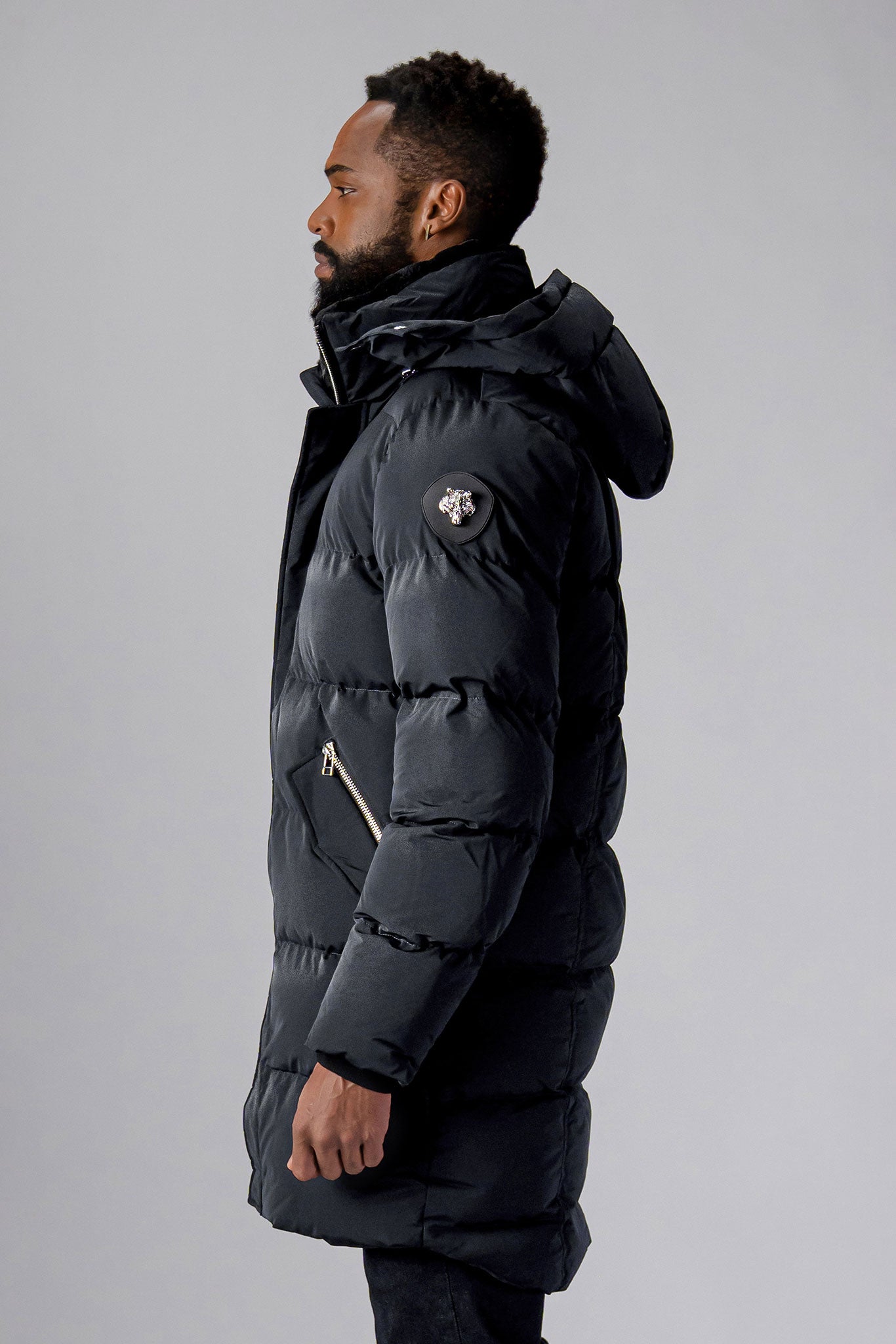Woodpecker Men's Penguin Long Winter coat. High-end Canadian designer winter coat for men in "Black Diamond" colour. Woodpecker cruelty-free winter coat designed in Canada. Men's heavy weight long length premium designer jacket for winter. Superior quality warm winter coat for men. Moose Knuckles, Canada Goose, Mackage, Montcler, Will Poho, Willbird, Nic Bayley. Extra warm. Shiny parka. Stylish winter jacket. Designer winter coat.