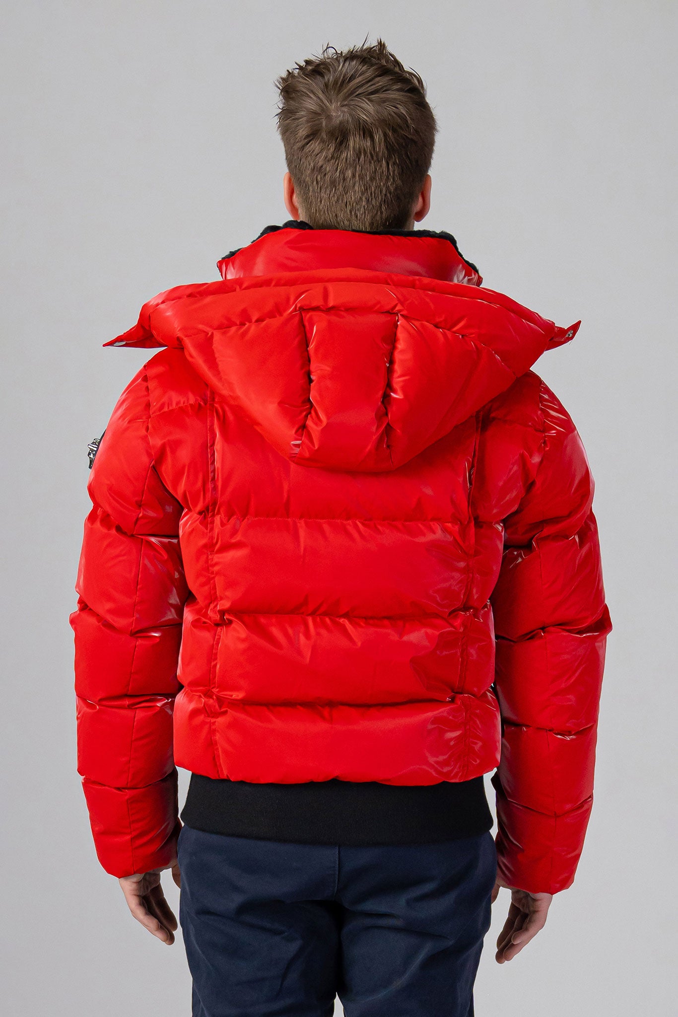 Woodpecker Men's Woody Bomber Winter coat. High-end Canadian designer winter coat for men in “Fashion Santa" colour. Woodpecker cruelty-free winter coat designed in Canada. Men's heavy weight short length premium designer jacket for winter. Superior quality warm winter coat for men. Moose Knuckles, Canada Goose, Mackage, Montcler, Will Poho, Willbird, Nic Bayley. Shiny parka. Stylish winter jacket. Designer winter coat.