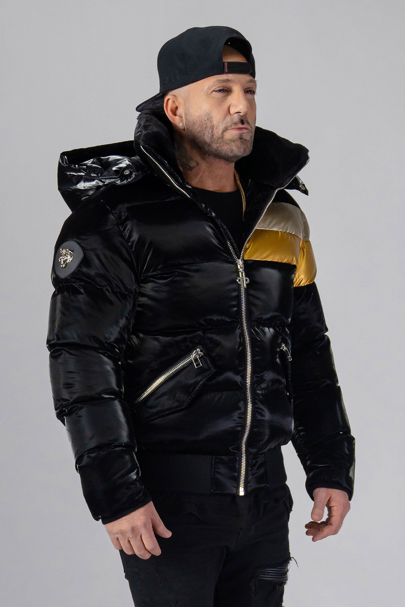Woodpecker Men's Woody Bomber Winter coat. High-end Canadian designer winter coat for men in “Firebird" colour. Woodpecker cruelty-free winter coat designed in Canada. Men's heavy weight short length premium designer jacket for winter. Superior quality warm winter coat for men. Moose Knuckles, Canada Goose, Mackage, Montcler, Will Poho, Willbird, Nic Bayley. Shiny parka. Stylish winter jacket. Designer winter coat.
