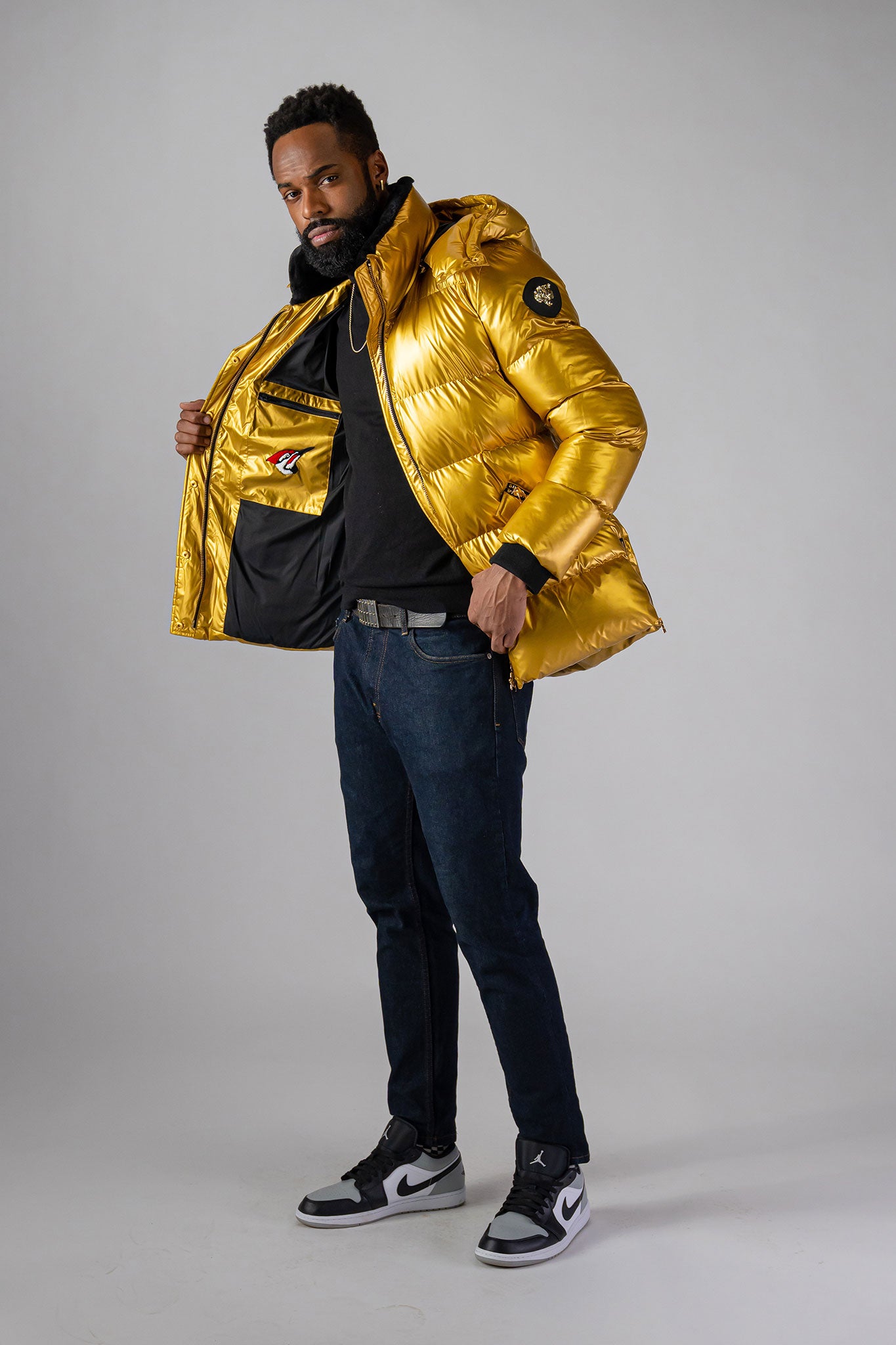 High-end Canadian designer winter coat for men in "Gold" colour. Woodpecker cruelty-free winter coat designed in Canada. Men's heavy weight medium length premium designer jacket for winter. Superior quality warm winter coat for men. Moose Knuckles, Canada Goose, Mackage, Montcler, Will Poho, Willbird, Nic Bayley. Shiny parka. Stylish winter jacket. Designer winter coat.