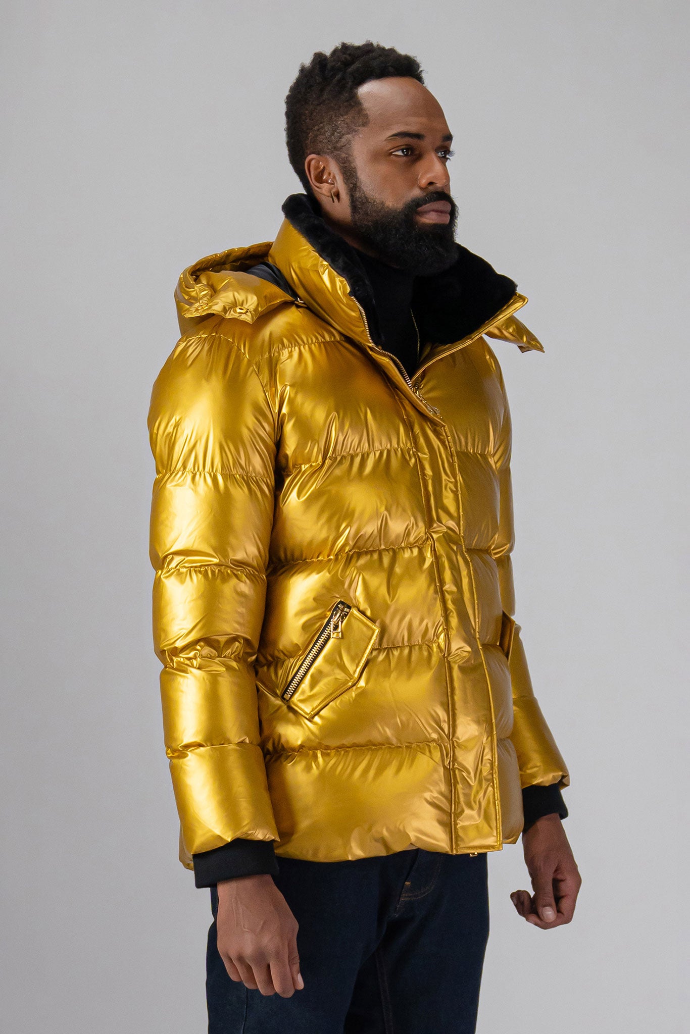 High-end Canadian designer winter coat for men in "Gold" colour. Woodpecker cruelty-free winter coat designed in Canada. Men's heavy weight medium length premium designer jacket for winter. Superior quality warm winter coat for men. Moose Knuckles, Canada Goose, Mackage, Montcler, Will Poho, Willbird, Nic Bayley. Shiny parka. Stylish winter jacket. Designer winter coat.