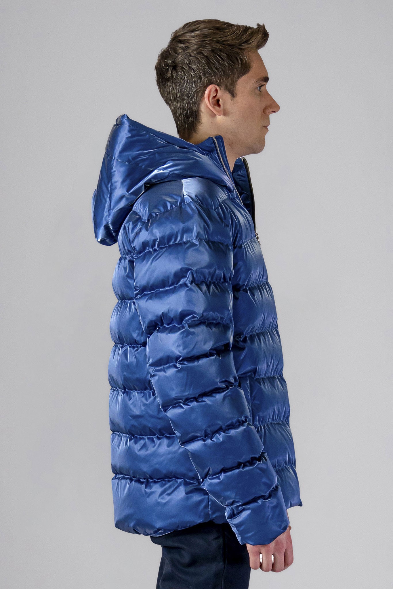 High-end Canadian designer winter coat for men in "Flash Blue" colour. Woodpecker cruelty-free winter coat designed in Canada. Men's medium weight medium length premium designer jacket for winter. Superior quality warm winter coat for men. Moose Knuckles, Canada Goose, Mackage, Montcler, Will Poho, Willbird, Nic Bayley. Shiny parka. Stylish winter jacket. Designer winter coat.