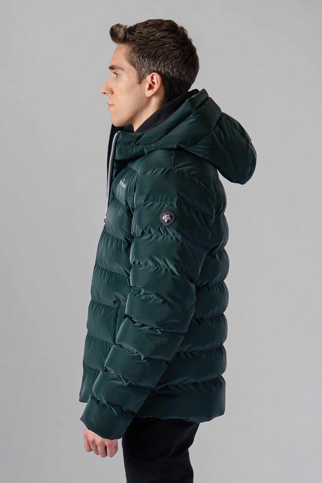 Woodpecker Men's Sparrow Winter coat. High-end Canadian designer winter coat for men in "Green Diamond" colour. Woodpecker cruelty-free winter coat designed in Canada. Men's medium weight medium length premium designer jacket for winter. Superior quality warm winter coat for men. Moose Knuckles, Canada Goose, Mackage, Montcler, Will Poho, Willbird, Nic Bayley. Shiny parka. Stylish winter jacket. Designer winter coat.