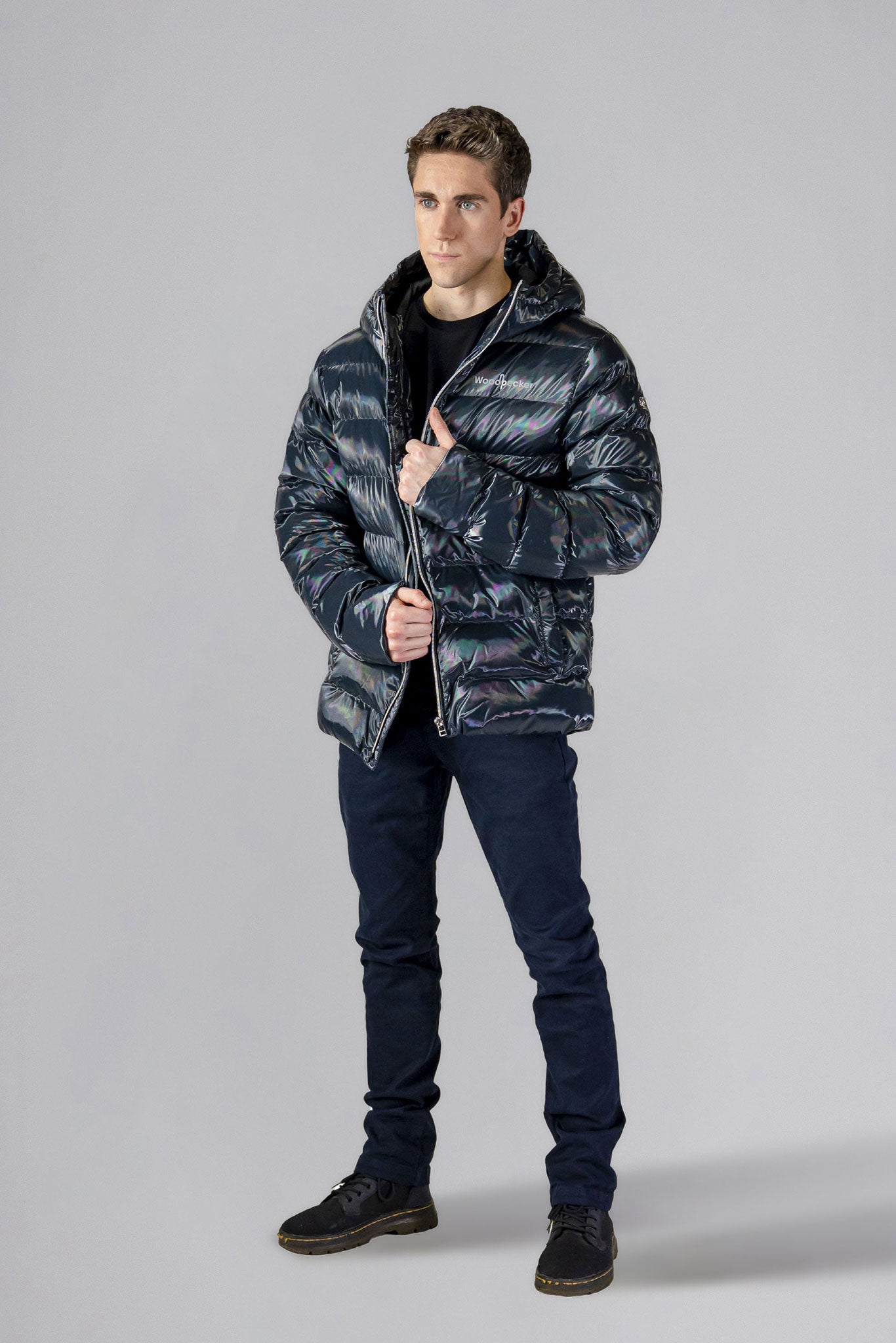 High-end Canadian designer winter coat for men in "Raven Black" colour. Woodpecker cruelty-free winter coat designed in Canada. Men's medium weight medium length premium designer jacket for winter. Superior quality warm winter coat for men. Moose Knuckles, Canada Goose, Mackage, Montcler, Will Poho, Willbird, Nic Bayley. Shiny parka. Stylish winter jacket. Designer winter coat.