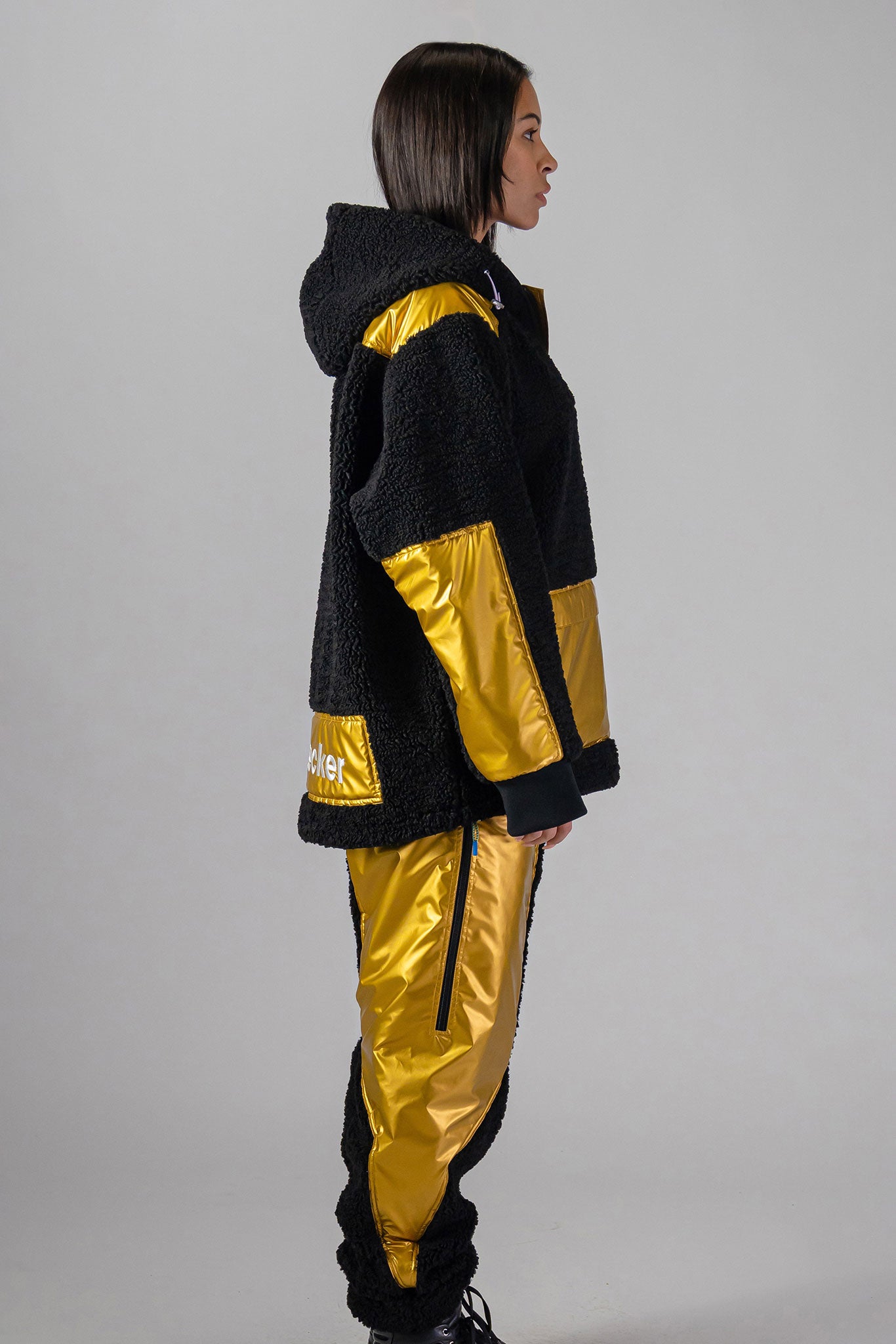 Woodpecker Unisex Fleece Track Pants. High-end Canadian designer winter fleece in "Gold" colour. Woodpecker fleece pants designed in Canada. Warm premium designer fleece pants for winter. Superior quality warm fleece track pants. Moose Knuckles, Canada Goose, Mackage, Montcler, Will Poho, Willbird, Nic Bayley. Cozy for at-home wear.