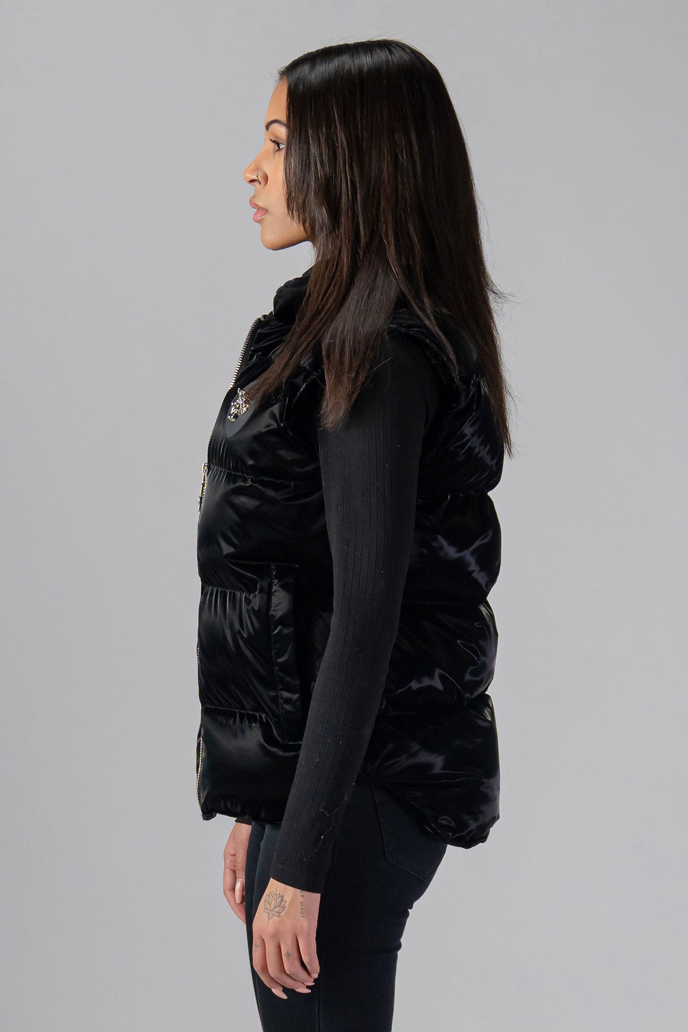 Woodpecker Unisex Winter Vest. High-end Canadian designer winter vest in "All Wet Black" colour. Woodpecker cruelty-free vest designed in Canada. Heavy weight short length premium designer vest for winter. Superior quality warm winter vest. Moose Knuckles, Canada Goose, Mackage, Montcler, Will Poho, Willbird, Nic Bayley. Extra warm. Shiny vest. Stylish winter vest. Designer winter vest.