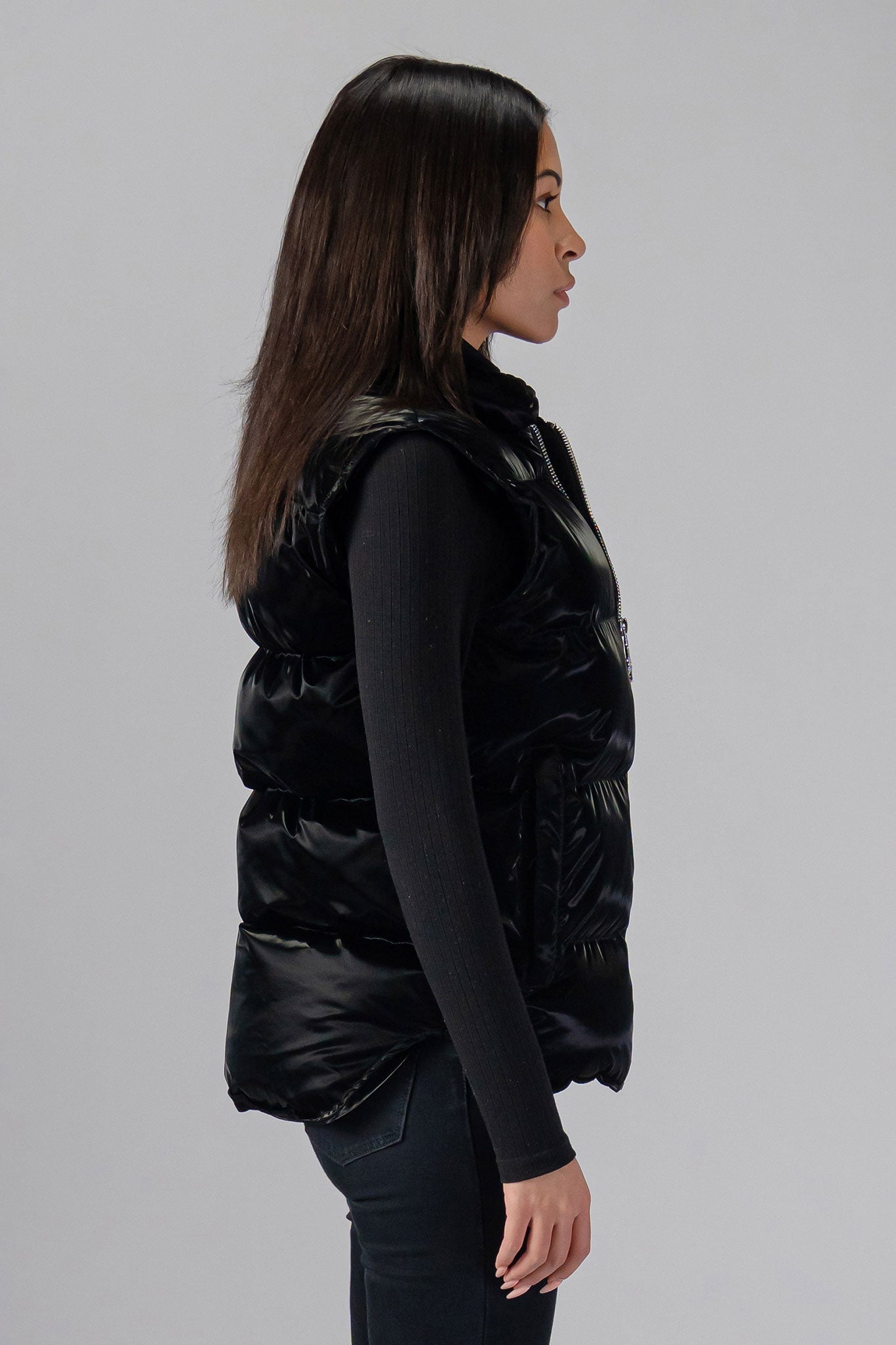Woodpecker Unisex Winter Vest. High-end Canadian designer winter vest in "All Wet Black" colour. Woodpecker cruelty-free vest designed in Canada. Heavy weight short length premium designer vest for winter. Superior quality warm winter vest. Moose Knuckles, Canada Goose, Mackage, Montcler, Will Poho, Willbird, Nic Bayley. Extra warm. Shiny vest. Stylish winter vest. Designer winter vest.