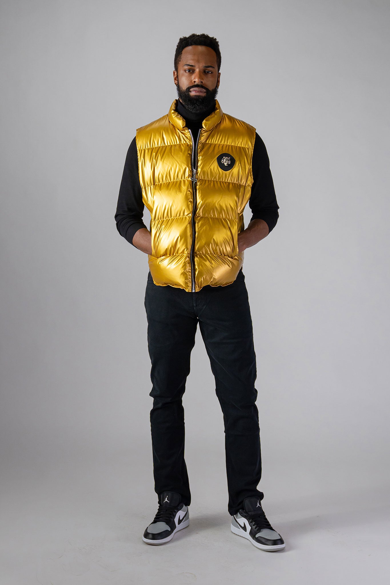 Woodpecker Unisex Winter Vest. High-end Canadian designer winter vest in "Gold" colour. Woodpecker cruelty-free vest designed in Canada. Heavy weight short length premium designer vest for winter. Superior quality warm winter vest. Moose Knuckles, Canada Goose, Mackage, Montcler, Will Poho, Willbird, Nic Bayley. Extra warm. Shiny vest. Stylish winter vest. Designer winter vest.