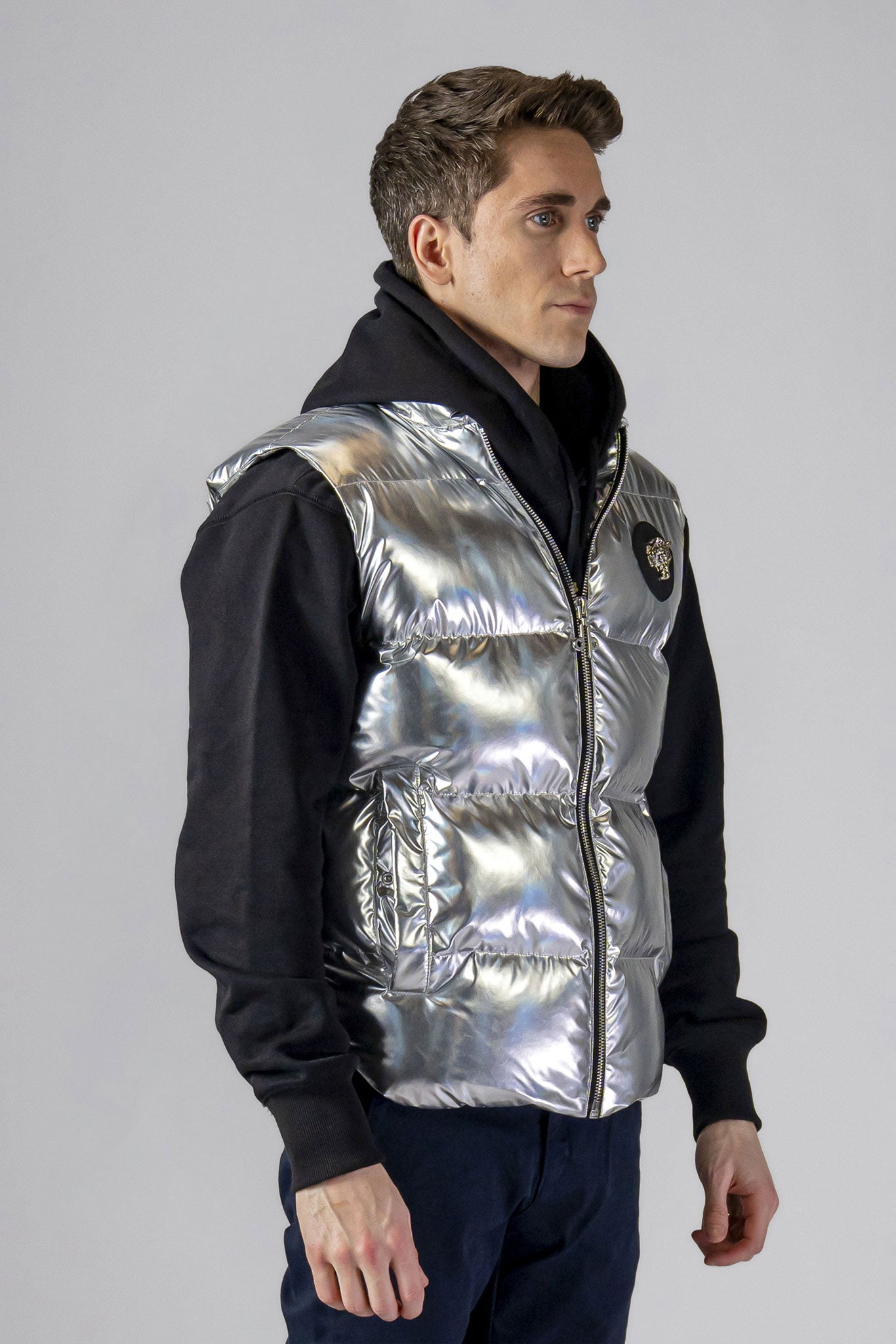 Woodpecker Unisex Winter Vest. High-end Canadian designer winter vest in "Silver" colour. Woodpecker cruelty-free vest designed in Canada. Heavy weight short length premium designer vest for winter. Superior quality warm winter vest. Moose Knuckles, Canada Goose, Mackage, Montcler, Will Poho, Willbird, Nic Bayley. Extra warm. Shiny vest. Stylish winter vest. Designer winter vest.
