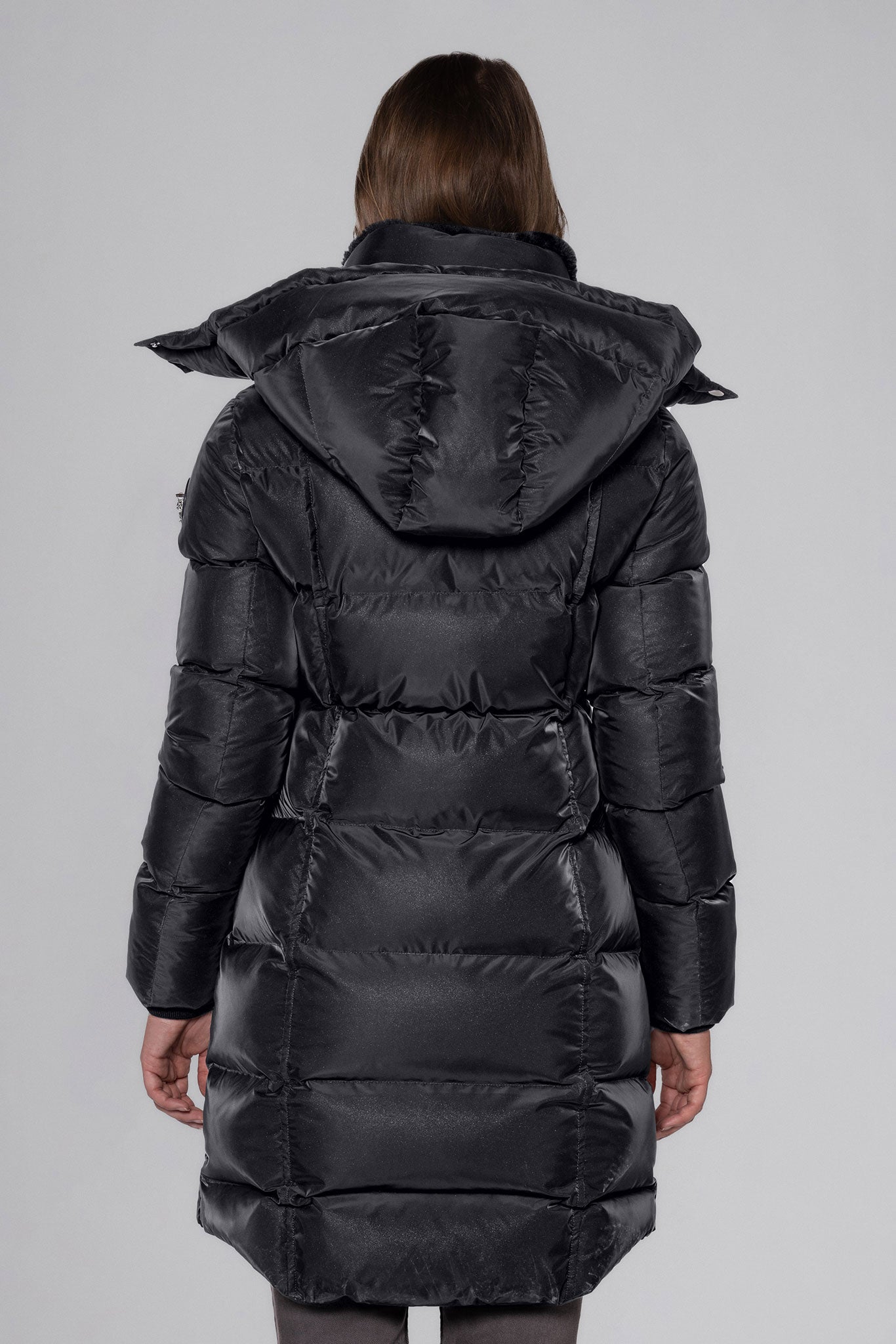 Woodpecker Women's Penguin Long Winter coat. High-end Canadian designer winter coat for women in "Black Diamond" colour. Woodpecker cruelty-free winter coat designed in Canada. Women's heavy weight long length premium designer jacket for winter. Superior quality warm winter coat for women. Moose Knuckles, Canada Goose, Mackage, Montcler, Will Poho, Willbird, Nic Bayley. Extra warm. Shiny parka. Stylish winter jacket. Designer winter coat.