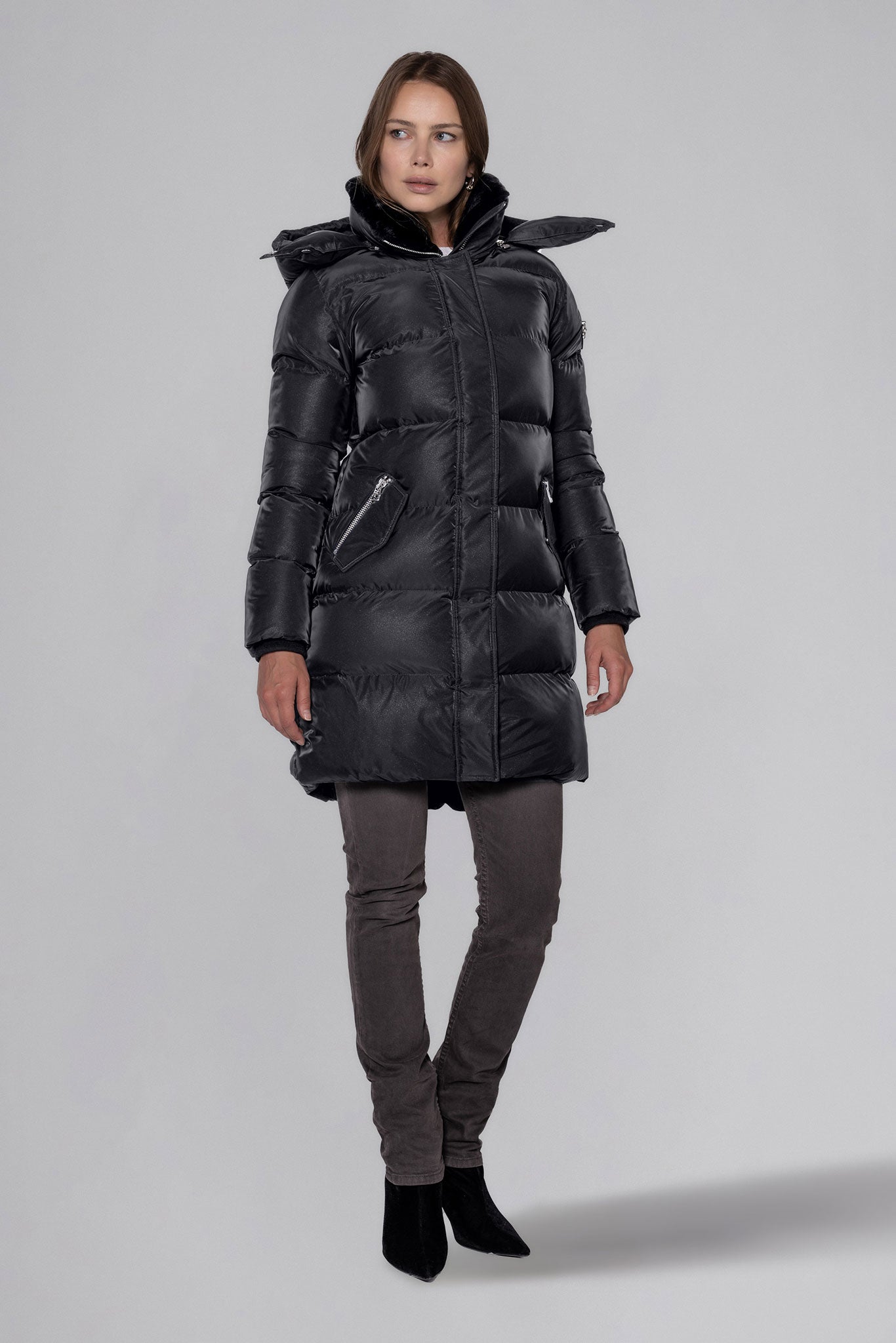 Woodpecker Women's Penguin Long Winter coat. High-end Canadian designer winter coat for women in "Black Diamond" colour. Woodpecker cruelty-free winter coat designed in Canada. Women's heavy weight long length premium designer jacket for winter. Superior quality warm winter coat for women. Moose Knuckles, Canada Goose, Mackage, Montcler, Will Poho, Willbird, Nic Bayley. Extra warm. Shiny parka. Stylish winter jacket. Designer winter coat.