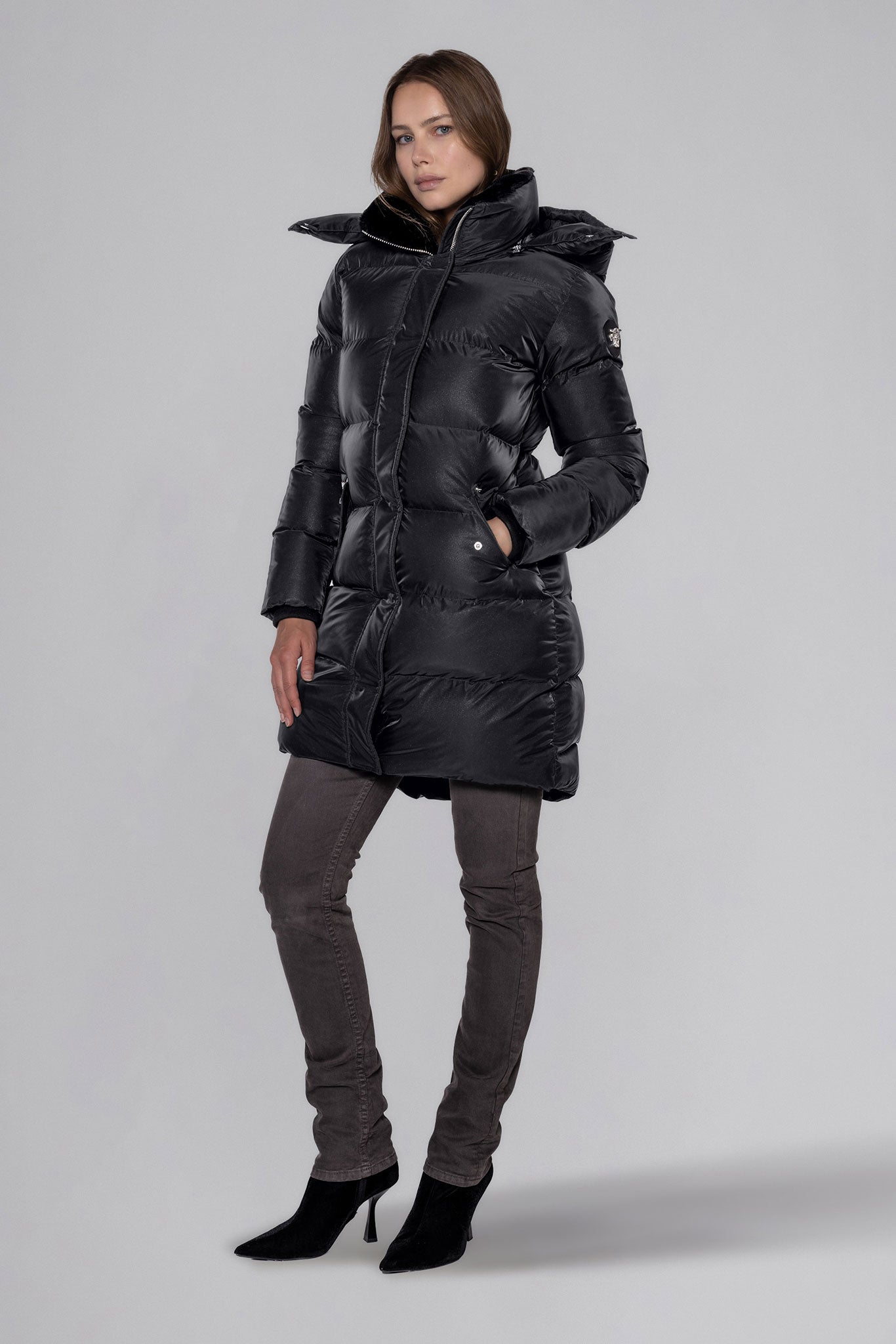 Woodpecker Women's Penguin Long Winter coat. High-end Canadian designer winter coat for women in "Black Diamond" colour. Woodpecker cruelty-free winter coat designed in Canada. Women's heavy weight long length premium designer jacket for winter. Superior quality warm winter coat for women. Moose Knuckles, Canada Goose, Mackage, Montcler, Will Poho, Willbird, Nic Bayley. Extra warm. Shiny parka. Stylish winter jacket. Designer winter coat.