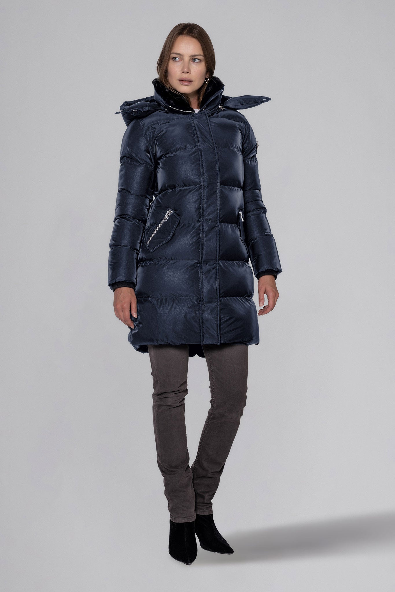 Woodpecker Women's Penguin Long Winter coat. High-end Canadian designer winter coat for women in "Blue Diamond" colour. Woodpecker cruelty-free winter coat designed in Canada. Women's heavy weight long length premium designer jacket for winter. Superior quality warm winter coat for women. Moose Knuckles, Canada Goose, Mackage, Montcler, Will Poho, Willbird, Nic Bayley. Extra warm. Shiny parka. Stylish winter jacket. Designer winter coat.