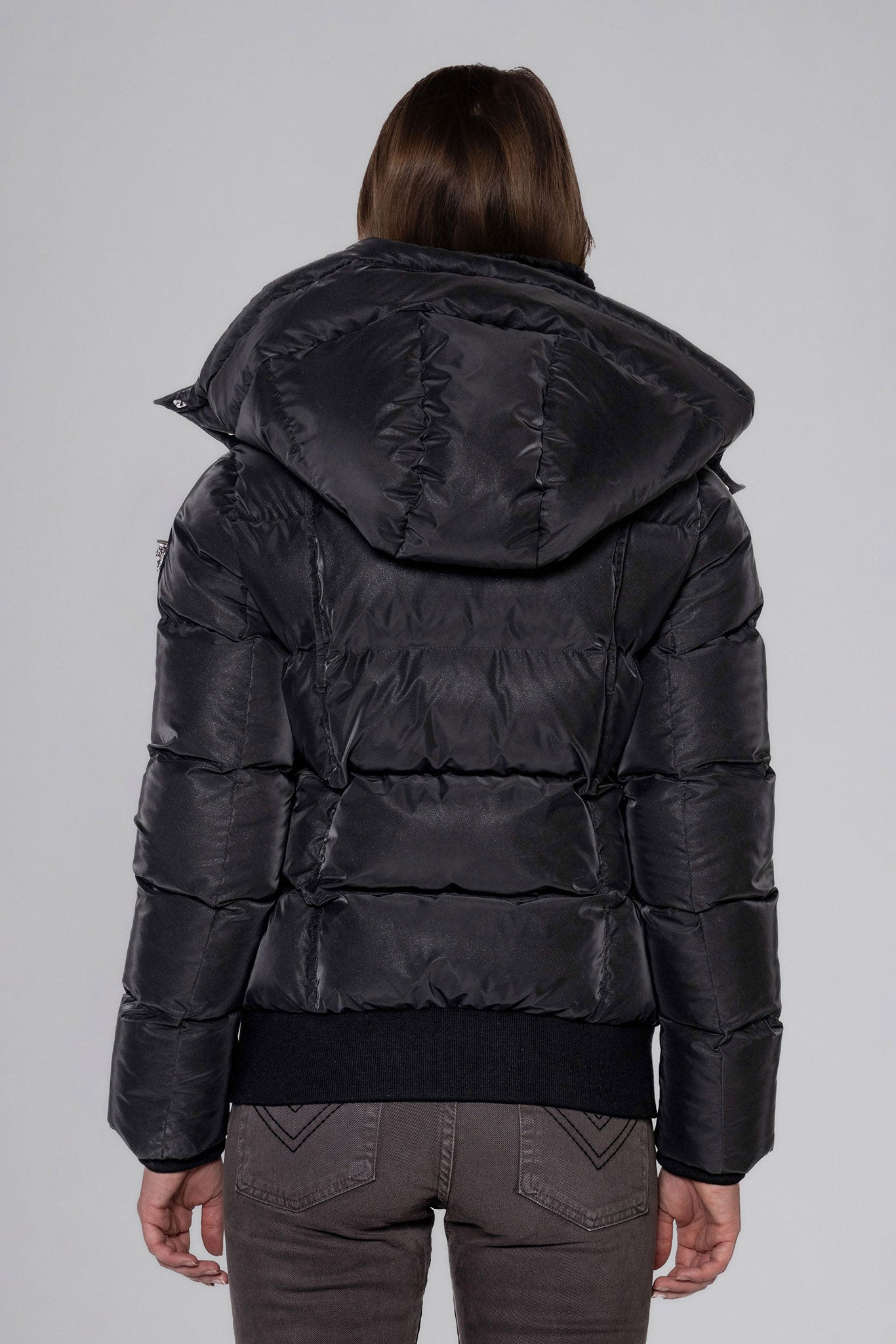 Woodpecker Women's Woody Bomber Winter coat. High-end Canadian designer winter coat for women in "Black Diamond" colour. Woodpecker cruelty-free winter coat designed in Canada. Women's heavy weight short length premium designer jacket for winter. Superior quality warm winter coat for women. Moose Knuckles, Canada Goose, Mackage, Montcler, Will Poho, Willbird, Nic Bayley. Shiny parka. Stylish winter jacket. Designer winter coat.
