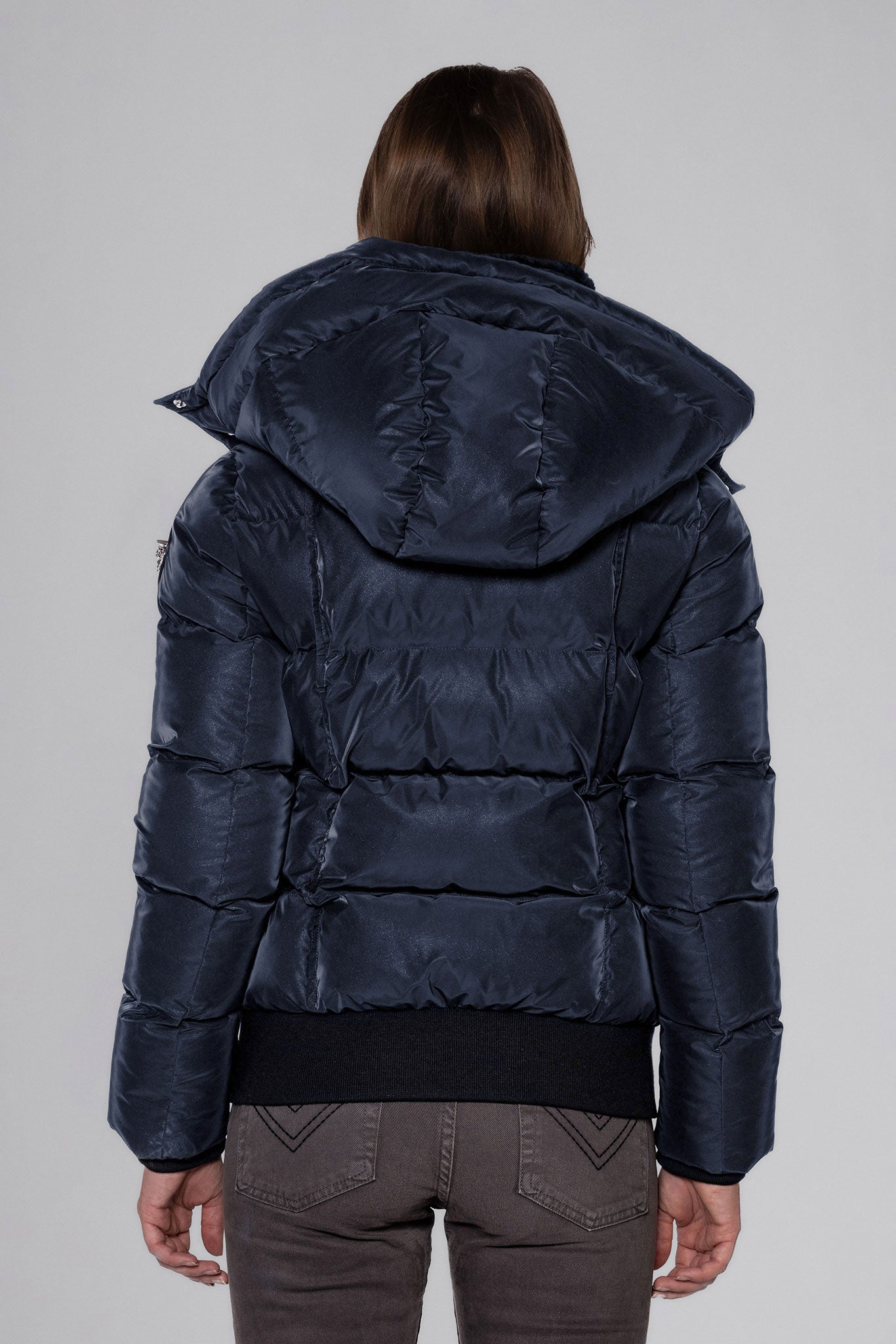 Woodpecker Women's Woody Bomber Winter coat. High-end Canadian designer winter coat for women in "Blue Diamond" colour. Woodpecker cruelty-free winter coat designed in Canada. Women's heavy weight short length premium designer jacket for winter. Superior quality warm winter coat for women. Moose Knuckles, Canada Goose, Mackage, Montcler, Will Poho, Willbird, Nic Bayley. Shiny parka. Stylish winter jacket. Designer winter coat.