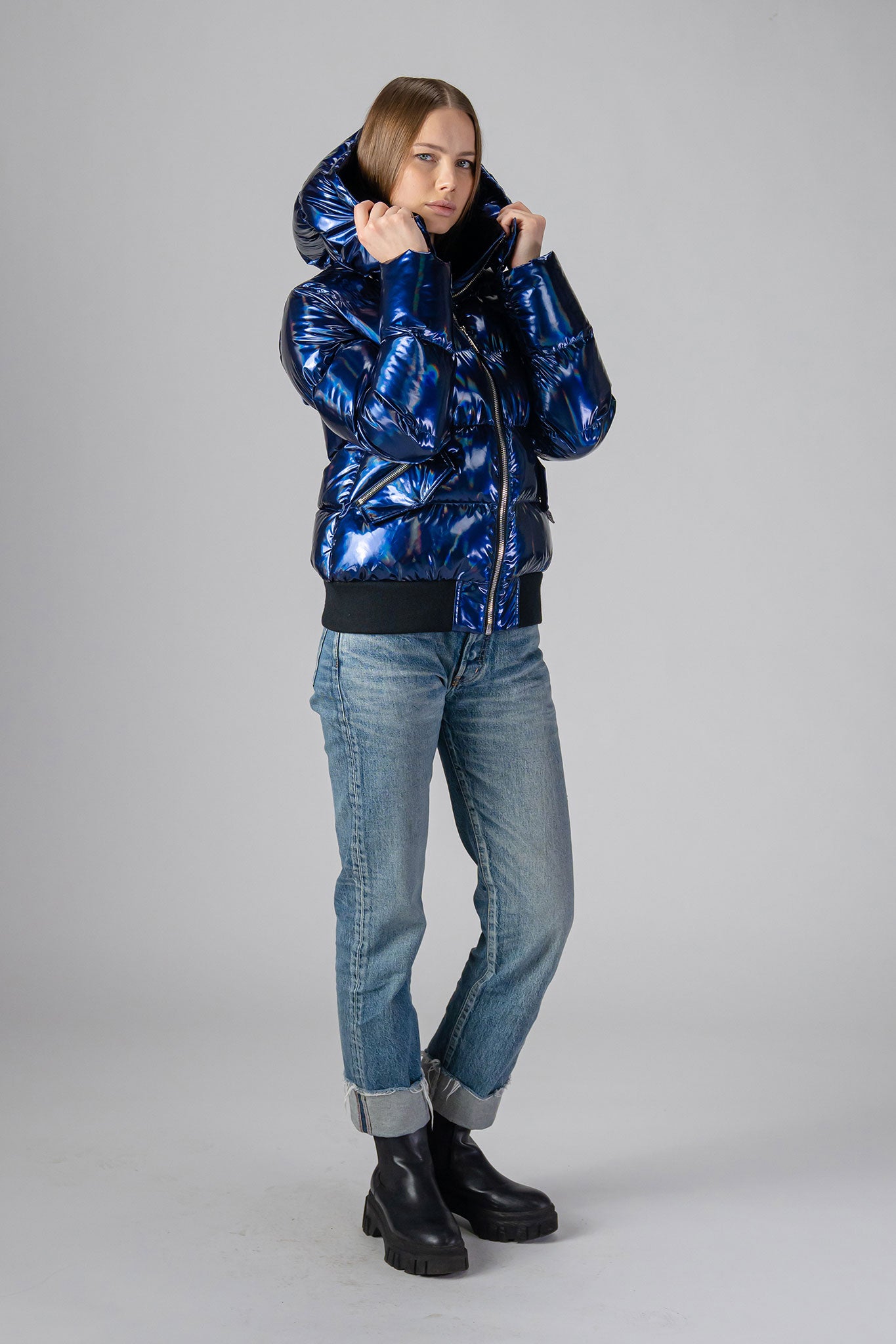 coat. High-end Canadian designer winter coat for women in "Oily Blue" colour. Woodpecker cruelty-free winter coat designed in Canada. Women's heavy weight short length premium designer jacket for winter. Superior quality warm winter coat for women. Moose Knuckles, Canada Goose, Mackage, Montcler, Will Poho, Willbird, Nic Bayley. Shiny parka. Stylish winter jacket. Designer winter coat.