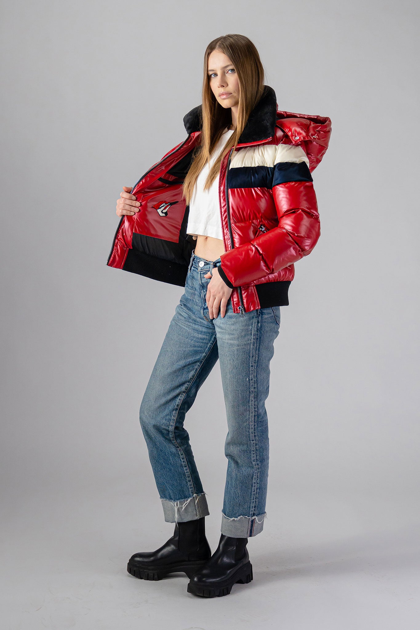 Woodpecker Women's Woody Bomber Winter coat. High-end Canadian designer winter coat for women in "Red White Blue" colour. Woodpecker cruelty-free winter coat designed in Canada. Women's heavy weight short length premium designer jacket for winter. Superior quality warm winter coat for women. Moose Knuckles, Canada Goose, Mackage, Montcler, Will Poho, Willbird, Nic Bayley. Shiny parka. Stylish winter jacket. Designer winter coat.