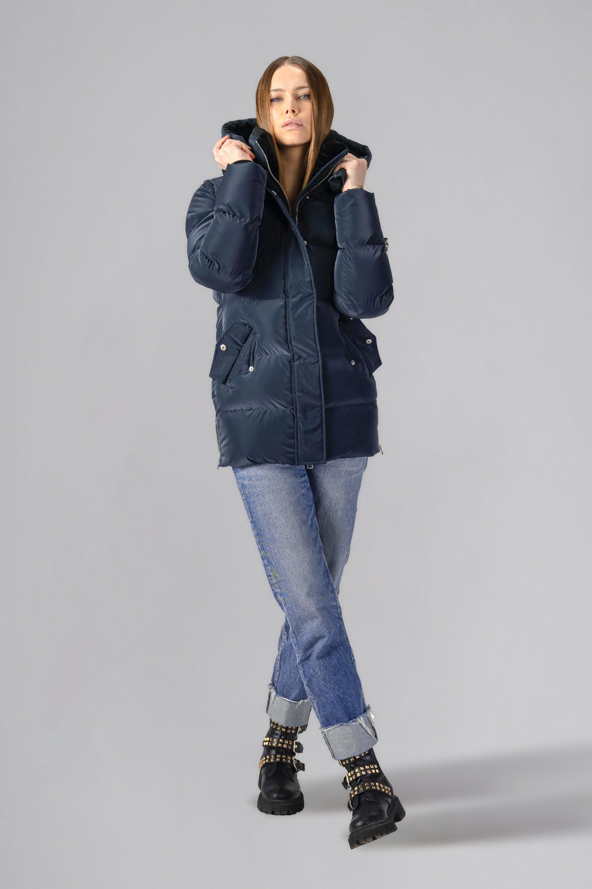 Woodpecker Women's Bumnester Winter coat. High-end Canadian designer winter coat for women in shiny "Blue Diamond" colour. Woodpecker cruelty-free winter coat designed in Canada. Women's heavy weight medium length premium designer jacket for winter. Superior quality warm winter coat for women. Moose Knuckles, Canada Goose, Mackage, Montcler, Will Poho, Willbird, Nic Bayley. Extra warm. Shiny parka. Stylish winter jacket. Designer winter coat.