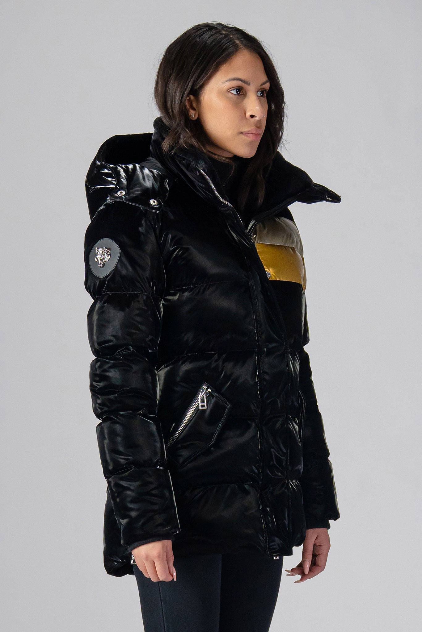 Woodpecker Women's Bumnester Winter coat. High-end Canadian designer winter coat for women in shiny "Firebird" colour. Woodpecker cruelty-free winter coat designed in Canada. Women's heavy weight medium length premium designer jacket for winter. Superior quality warm winter coat for women. Moose Knuckles, Canada Goose, Mackage, Montcler, Will Poho, Willbird, Nic Bayley. Extra warm. Shiny parka. Stylish winter jacket. Designer winter coat.