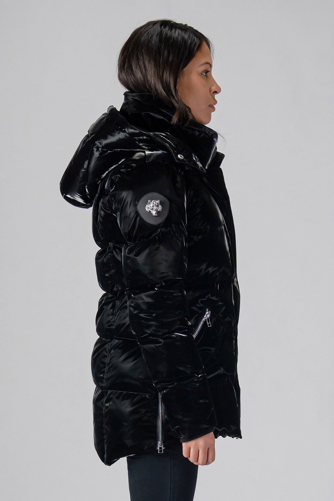 Woodpecker Women's Bumnester Winter coat. High-end Canadian designer winter coat for women in shiny "Firebird" colour. Woodpecker cruelty-free winter coat designed in Canada. Women's heavy weight medium length premium designer jacket for winter. Superior quality warm winter coat for women. Moose Knuckles, Canada Goose, Mackage, Montcler, Will Poho, Willbird, Nic Bayley. Extra warm. Shiny parka. Stylish winter jacket. Designer winter coat.