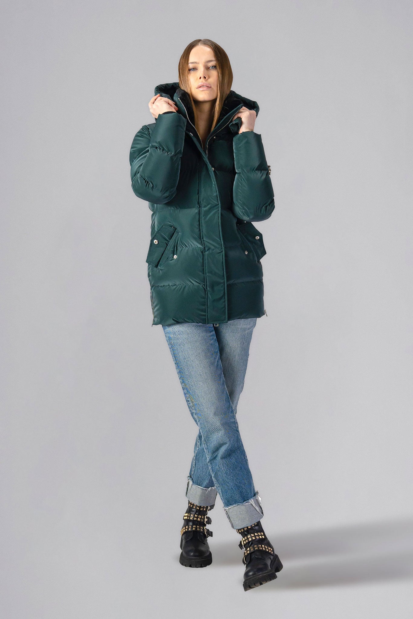 Woodpecker Women's Bumnester Winter coat. High-end Canadian designer winter coat for women in shiny "Green Diamond" colour. Woodpecker cruelty-free winter coat designed in Canada. Women's heavy weight medium length premium designer jacket for winter. Superior quality warm winter coat for women. Moose Knuckles, Canada Goose, Mackage, Montcler, Will Poho, Willbird, Nic Bayley. Extra warm. Shiny parka. Stylish winter jacket. Designer winter coat.