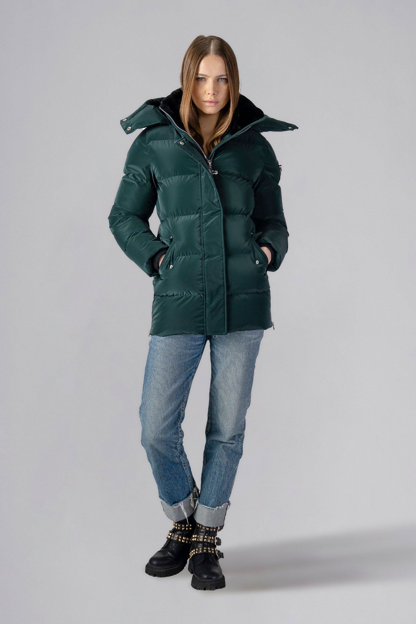 Woodpecker Women's Bumnester Winter coat. High-end Canadian designer winter coat for women in shiny "Green Diamond" colour. Woodpecker cruelty-free winter coat designed in Canada. Women's heavy weight medium length premium designer jacket for winter. Superior quality warm winter coat for women. Moose Knuckles, Canada Goose, Mackage, Montcler, Will Poho, Willbird, Nic Bayley. Extra warm. Shiny parka. Stylish winter jacket. Designer winter coat.