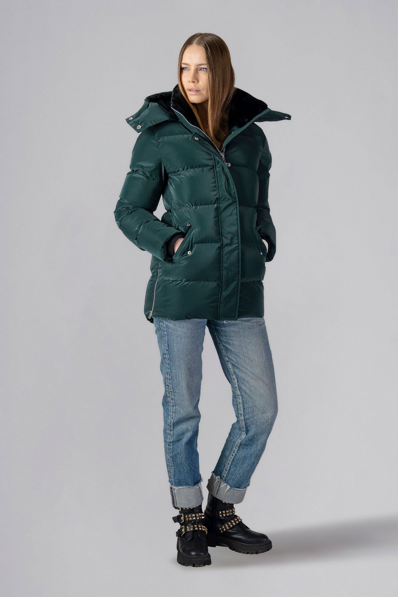 Woodpecker Women's Bumnester Winter coat. High-end Canadian designer winter coat for women in shiny "Green Diamond" colour. Woodpecker cruelty-free winter coat designed in Canada. Women's heavy weight medium length premium designer jacket for winter. Superior quality warm winter coat for women. Moose Knuckles, Canada Goose, Mackage, Montcler, Will Poho, Willbird, Nic Bayley. Extra warm. Shiny parka. Stylish winter jacket. Designer winter coat.