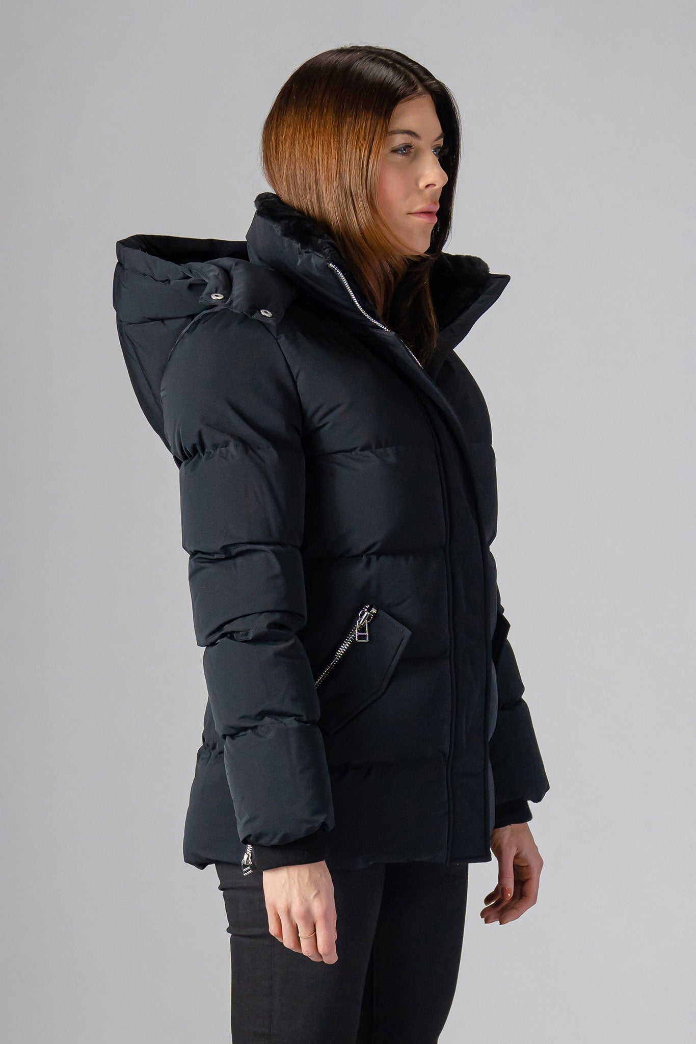 Woodpecker Women's Bumnester Winter coat. High-end Canadian designer winter coat for women in "Matte Black" colour. Woodpecker cruelty-free winter coat designed in Canada. Women's heavy weight medium length premium designer jacket for winter. Superior quality warm winter coat for women. Moose Knuckles, Canada Goose, Mackage, Montcler, Will Poho, Willbird, Nic Bayley. Extra warm. Shiny parka. Stylish winter jacket. Designer winter coat.