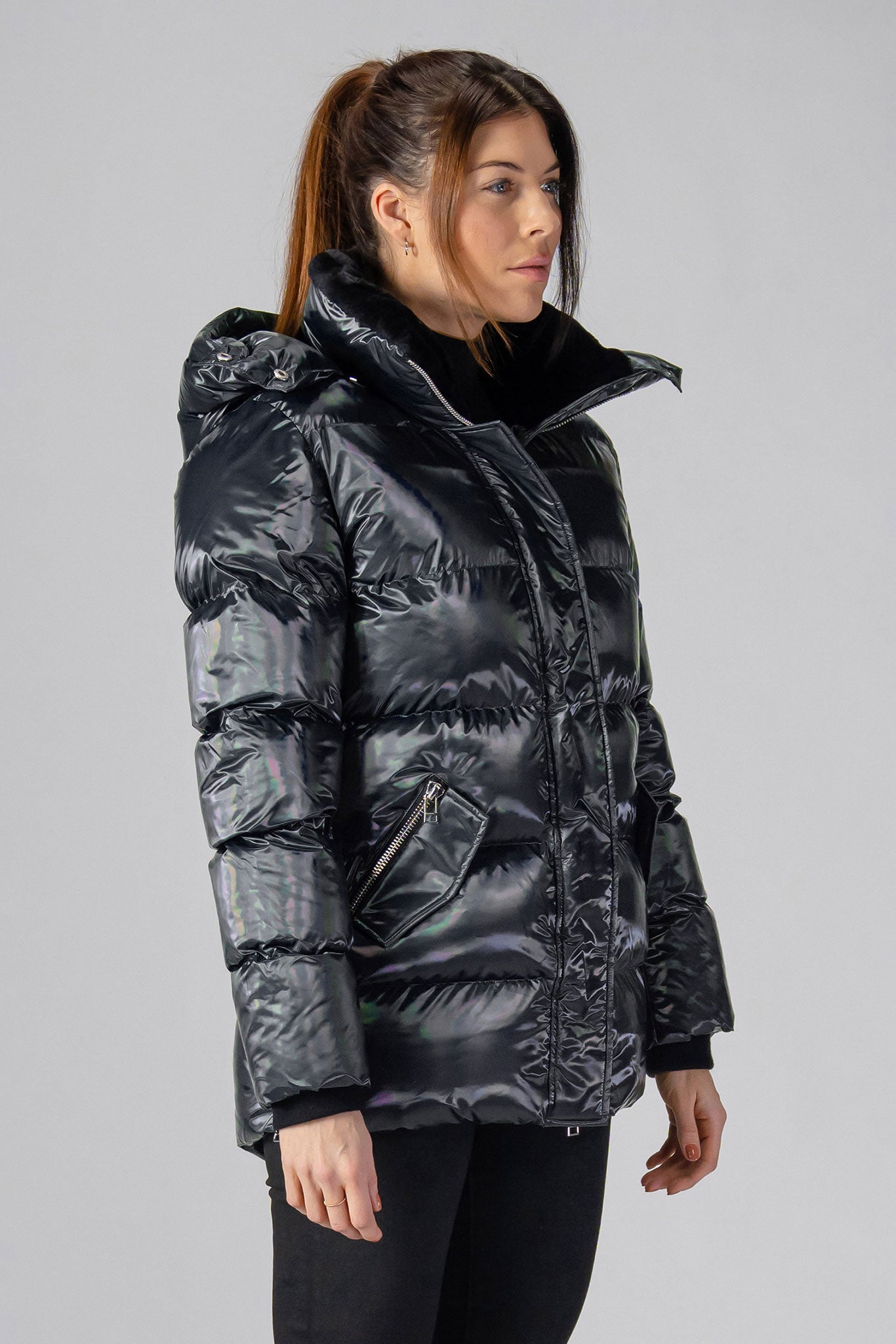 Woodpecker Women's Bumnester Winter coat. High-end Canadian designer winter coat for women in "Oily Black" colour. Woodpecker cruelty-free winter coat designed in Canada. Women's heavy weight medium length premium designer jacket for winter. Superior quality warm winter coat for women. Moose Knuckles, Canada Goose, Mackage, Montcler, Will Poho, Willbird, Nic Bayley. Extra warm. Shiny parka. Stylish winter jacket. Designer winter coat.