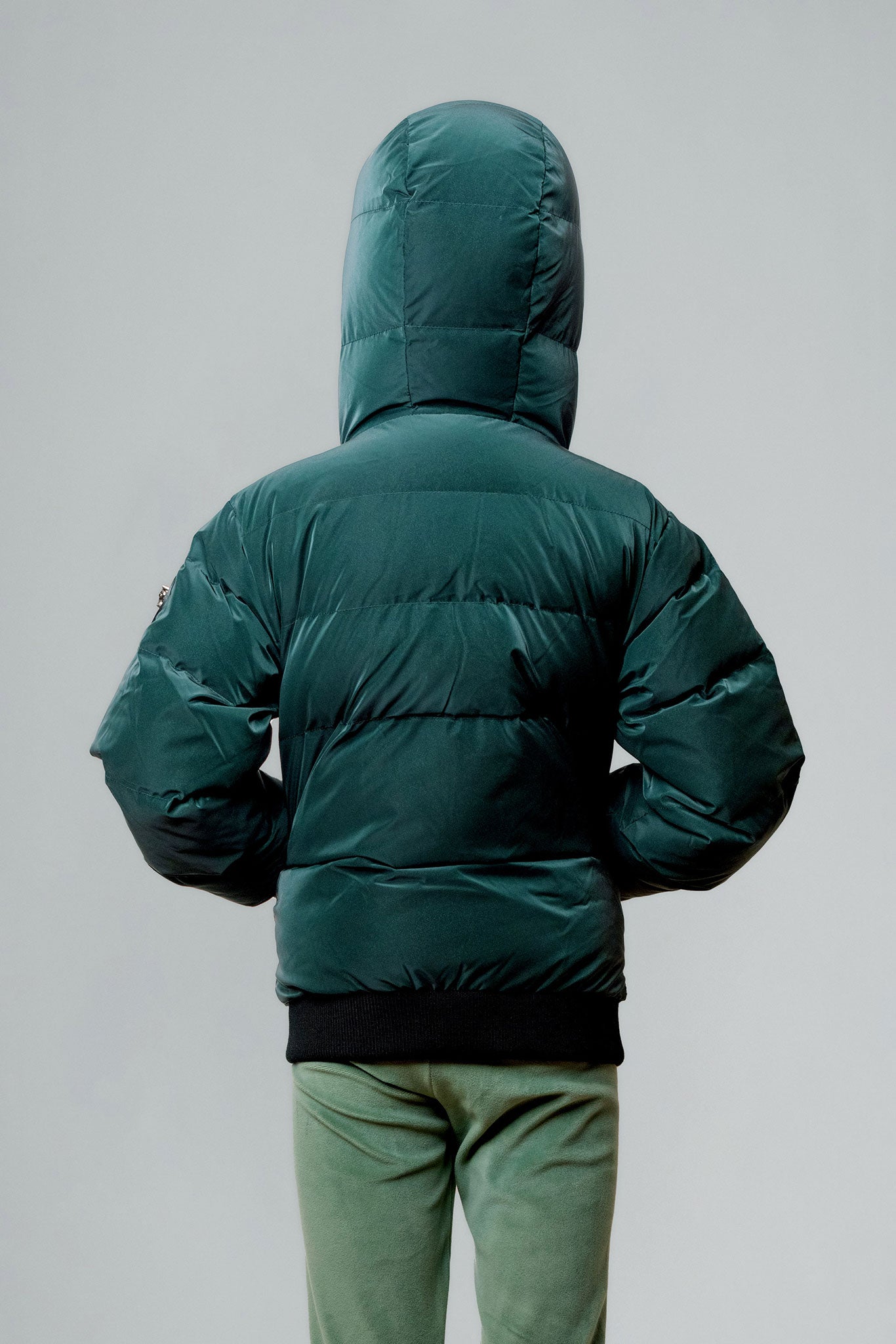 Woodpecker Kids' Chickadee Winter coat. High-end Canadian designer winter coat for Kids in "Green Diamond" colour. Woodpecker cruelty-free winter coat designed in Canada. Kids' heavy weight short length premium designer jacket for winter. Superior quality warm winter coat for kids. Moose Knuckles, Canada Goose, Mackage, Montcler, Will Poho, Willbird, Nic Bayley. Extra warm. Shiny parka. Stylish winter jacket. Designer winter coat.