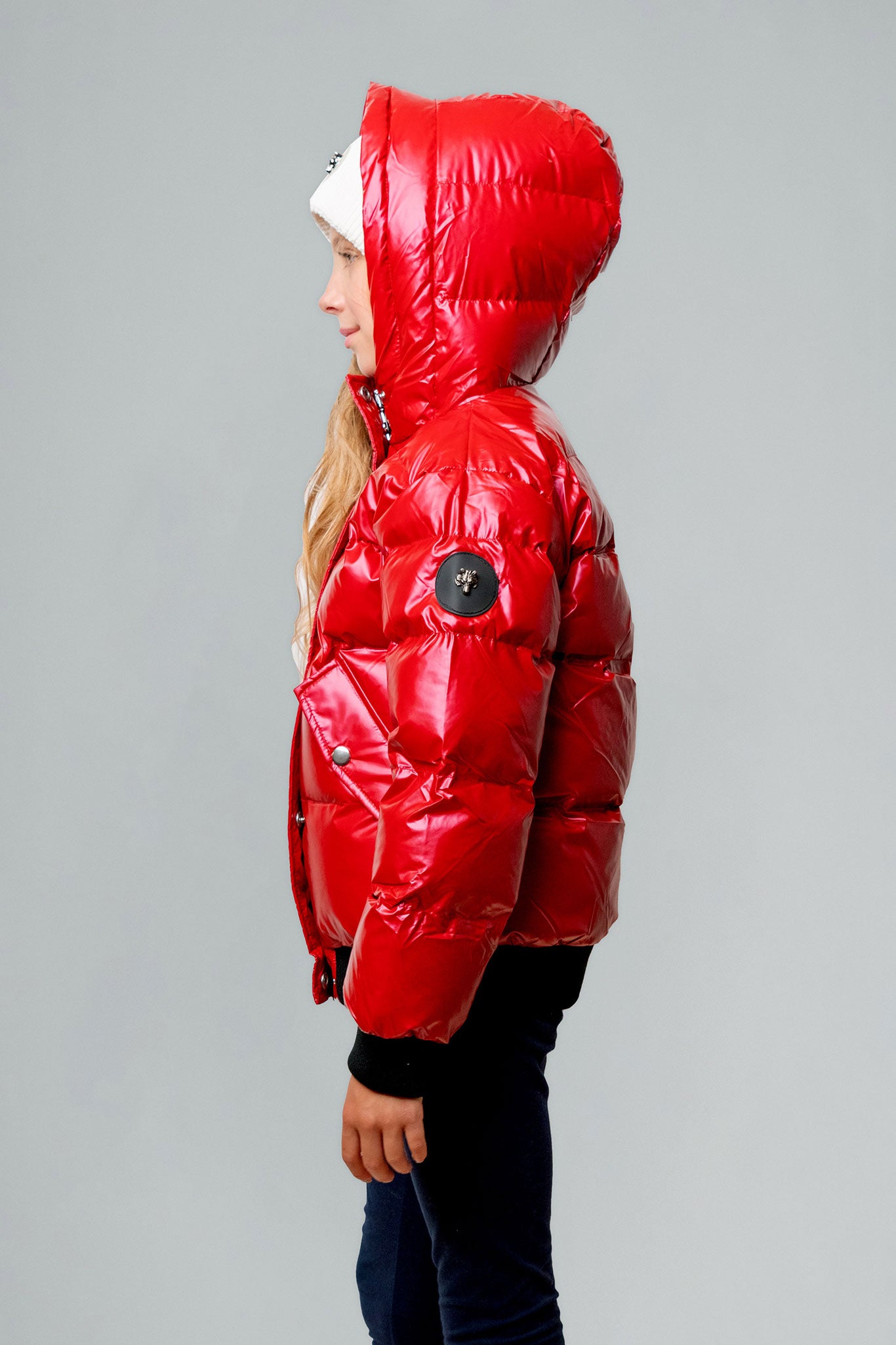Woodpecker Kids' Chickadee Winter coat. High-end Canadian designer winter coat for Kids in "Raspberry" colour. Woodpecker cruelty-free winter coat designed in Canada. Kids' heavy weight short length premium designer jacket for winter. Superior quality warm winter coat for kids. Moose Knuckles, Canada Goose, Mackage, Montcler, Will Poho, Willbird, Nic Bayley. Extra warm. Shiny parka. Stylish winter jacket. Designer winter coat.